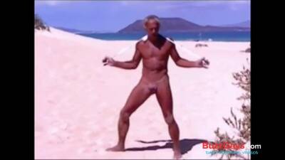 Tanned guy on beach in tiny string thong (temporarily!) - boyfriendtv.com