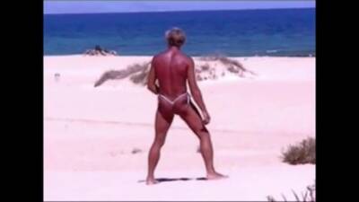 Tanned guy on beach in tiny string thong (temporarily!) - boyfriendtv.com