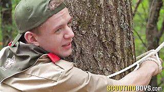 Scout Plays With A Twink While Being Tied In A Tree - gayxo.com